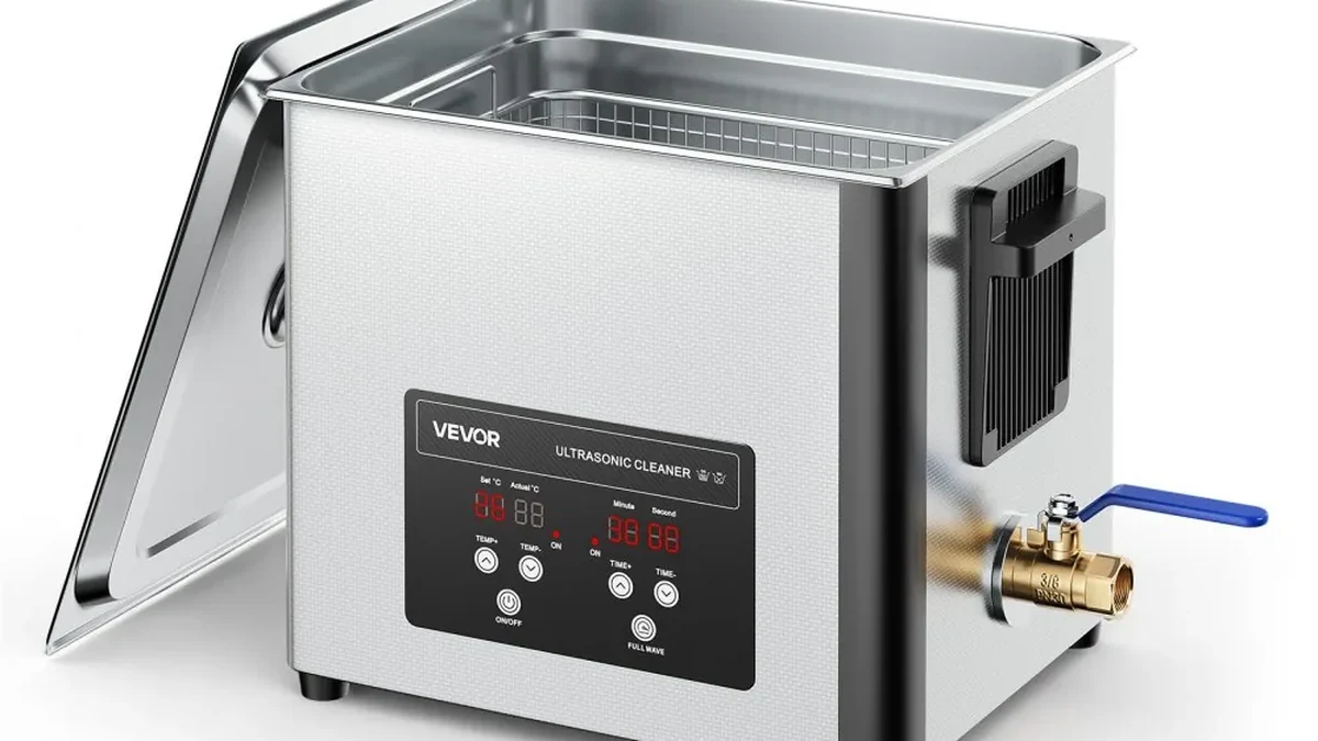 Stainless steel ultrasonic cleaner with lid open and basket