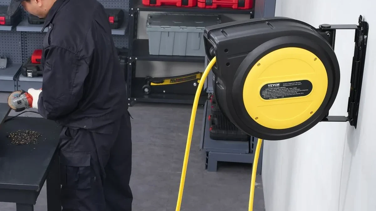 VEVOR retractable extension cord reel mounted on a workshop wall